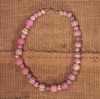 Necklace made from embroidered wool felt beads in shades of soft pink and beige