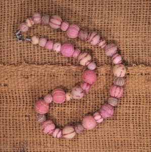 Necklace made from embroidered wool felt beads in shades of soft pink and beige