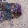 Merino wool skinny scarf in stripes of autumnal marl, green, and purple