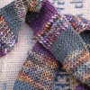 Merino wool skinny scarf in stripes of autumnal marl, green, and purple