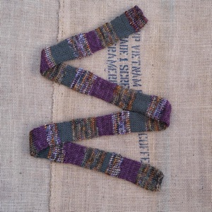 Merino wool skinny scarf in stripes of autumnal marl, green, and purple